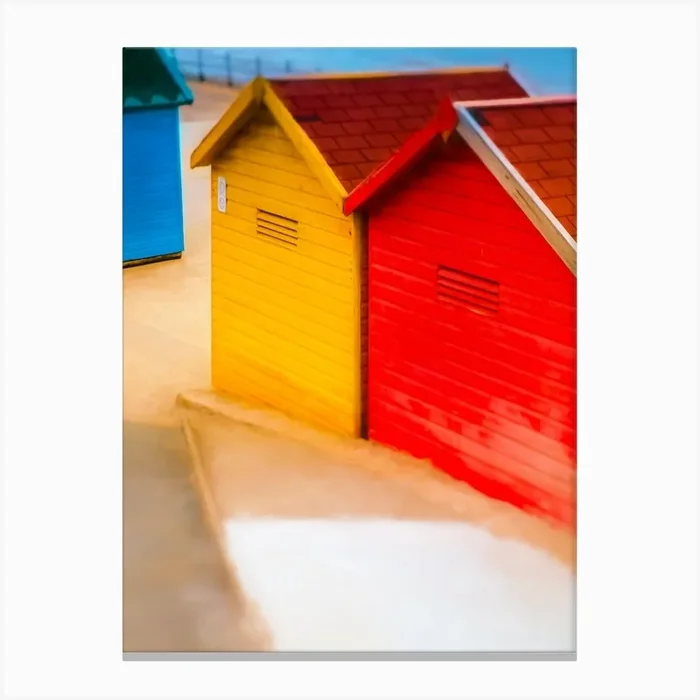 Beach Huts Of Whitby Rear View Canvas Print by Paul J Bucknall